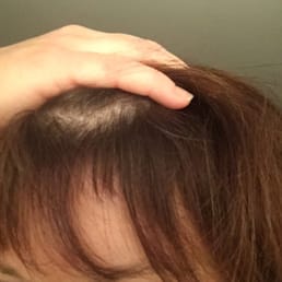 David cut a chunk of hair from the middle of my bangs.