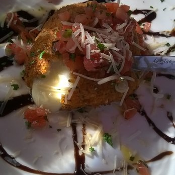 Mama Carolla's - fried fresh mozzarella crusted with breadcrumbs and stuffed with prosciutto. - Italian Near Me - Indianapolis, Indiana Mama Carolla's - fried fresh mozzarella crusted with breadcrumbs and stuffed with prosciutto. - Italian Near Me - Indianapolis, Indiana