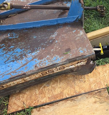 Bush hog had damage to the top right outside corner. the old metal was cut out with a plasma cutter and new steel was welded in. - this repair was done on a bush hog for a farmer. it qas a mobile job so I pulled up in the middle of the field and completed the repair.
