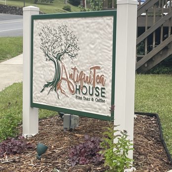 AntiquiTea House - a sign in front of a house - Coffee & Tea Near Me - Morgantown, West Virginia