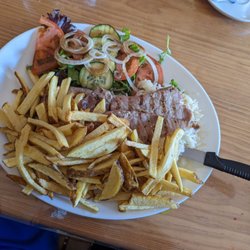 A Carvoaria - South African Restaurant - Pork steak minus the fried egg, salad, rice and extra chips