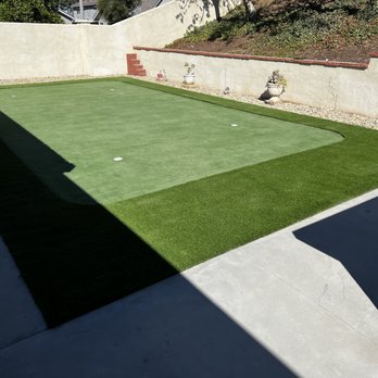 VC Hardscapes - a backyard with artificial turf - General Contractors Near Me