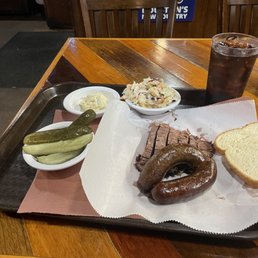 Spicy link, brisket, potato salad, cole slaw and pickles Spicy link, brisket, potato salad, cole slaw and pickles