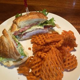 T. S. Effkatts' Unaffected Beauty Turkey, bacon, havarti, lettuce, tomato, and pesto mayo on a toasted croissant.