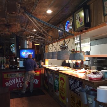 Sandy's Pizza - a man preparing food in a restaurant - Pizza Near Me - Fort Branch, Indiana Sandy's Pizza - a man preparing food in a restaurant - Pizza Near Me - Fort Branch, Indiana