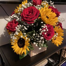Sunflowers and Orange roses  all the flowers were all nice and full!!