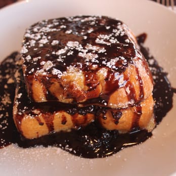 Uptown Kitchen - Stuffed French toast with chocolate and raspberries. - New American Near Me - Granger, Indiana
