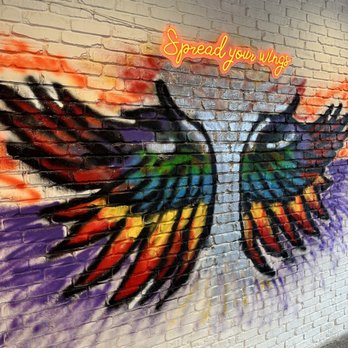 Yallah Hot Chicken - colorful wings painted on a brick wall - Halal Near Me - Orlando, Florida Yallah Hot Chicken - colorful wings painted on a brick wall - Halal Near Me - Orlando, Florida