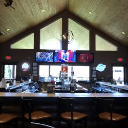 Palmyra Pub and Eatery - A look at the bar, where you can see part of the outdoor seating area beyond it.