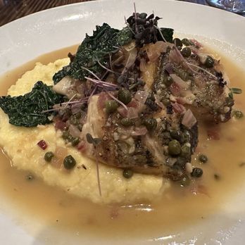 Cypress Hall - Local catch, sea bass, over polenta with spinach, capers and mushrooms. - New American Near Me - New Bern, North Carolina Cypress Hall - Local catch, sea bass, over polenta with spinach, capers and mushrooms. - New American Near Me - New Bern, North Carolina