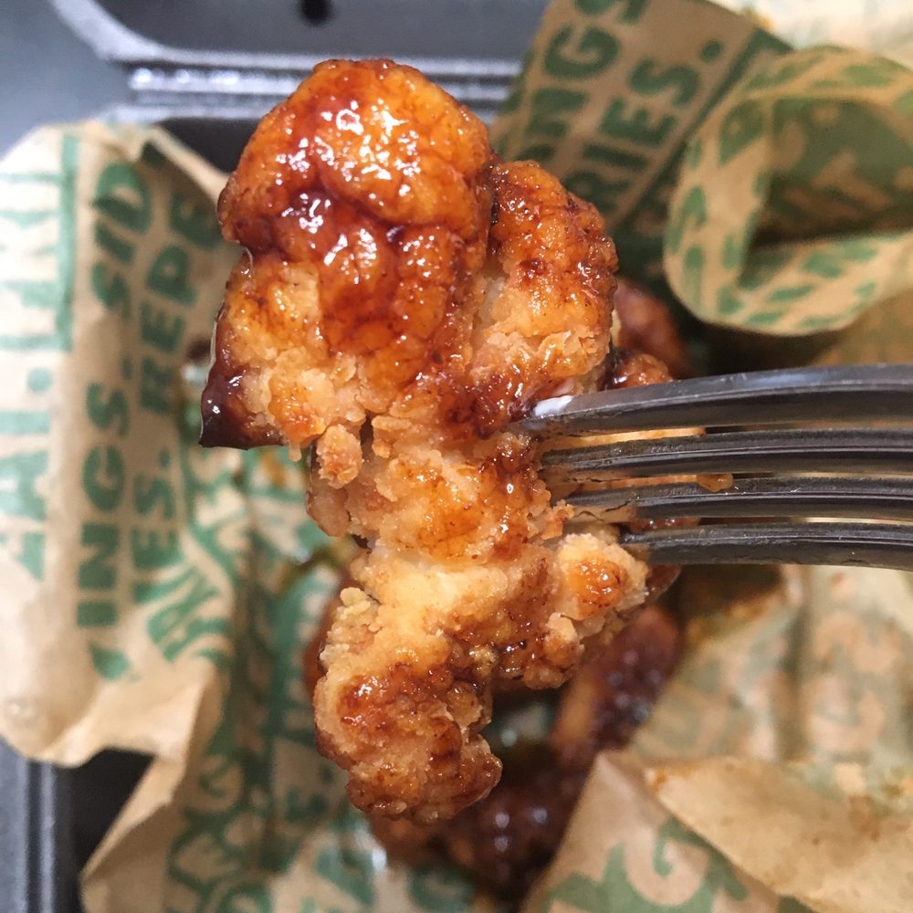 Wingstop - Half sauced wings. No I did not take a bite it is missing sauce. - Chicken Wings Near Me - Huntington Beach, California Wingstop - Half sauced wings. No I did not take a bite it is missing sauce. - Chicken Wings Near Me - Huntington Beach, California