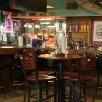 Ocean Front Bar and Grill - Man playing on phone before he handles the food. - American Near Me - Myrtle Beach, South Carolina Ocean Front Bar and Grill - Man playing on phone before he handles the food. - American Near Me - Myrtle Beach, South Carolina