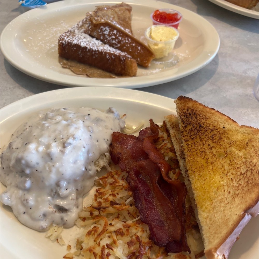 Your pick four : French toast, biscuit w/gravy, bacon, hash browns and addition of Texas toast w homemade strawberry jam. Yum!