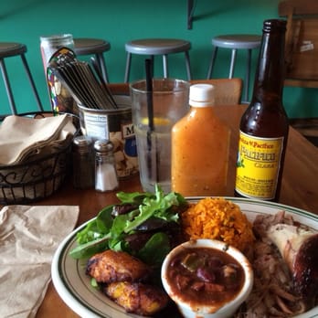 Parada 22 - Roasted pork shoulder, homemade salsa, and Pacifico with lime all laid out right and proper. - Latin American Near Me - San Francisco, California Parada 22 - Roasted pork shoulder, homemade salsa, and Pacifico with lime all laid out right and proper. - Latin American Near Me - San Francisco, California