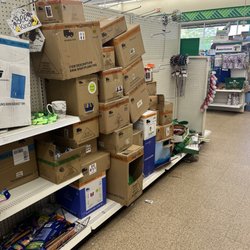 Dollar Tree - Don't bother to unpack boxes. Just stack on the shelves - 4/12/24