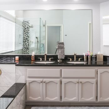 IPA Construction - a bathroom with a marble countertop - General Contractors Near Me IPA Construction - a bathroom with a marble countertop - General Contractors Near Me