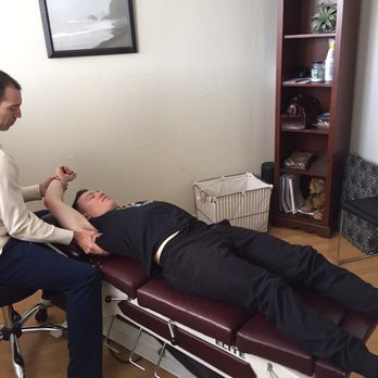 Hamilton Chiropractic - Dr. Ryan Hamilton utilizing Active Release Technique to treat a shoulder injury. - Chiropractors Near Me - San Mateo, California Hamilton Chiropractic - Dr. Ryan Hamilton utilizing Active Release Technique to treat a shoulder injury. - Chiropractors Near Me - San Mateo, California