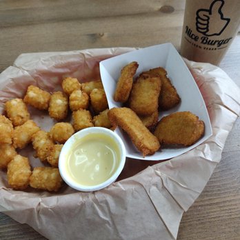 Nice Burger - Chicken nuggets, tater tots, and honey mustard dipping sauce (bee friendly) - Vegan Near Me - Stanton, California