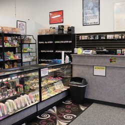 Vapor Uprising - Checkout, Disposables (left cabinet), and Papers/Wraps (right cabinet)
