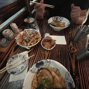 Aji Robota & Ramen Tomball - a man eating ramen with chopsticks - Ramen Near Me - Tomball, Texas