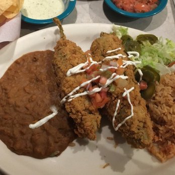Chuy's - Refried beans, stuffed chicken and cheese peppers with drizzled creamy jalapeño dip, rice, lettuce, and jalapeño. - Tex-Mex Near Me - Houston, Texas Chuy's - Refried beans, stuffed chicken and cheese peppers with drizzled creamy jalapeño dip, rice, lettuce, and jalapeño. - Tex-Mex Near Me - Houston, Texas