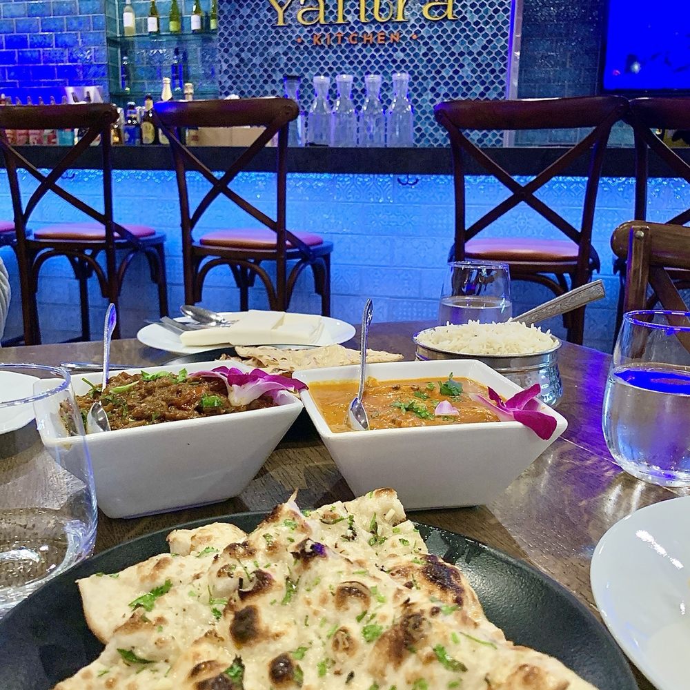 Yantra Kitchen - Butter Paneer Masala (right) and Baingan Bhartha (left) with Garlic Naan bread. - Indian Near Me - Artesia, California Yantra Kitchen - Butter Paneer Masala (right) and Baingan Bhartha (left) with Garlic Naan bread. - Indian Near Me - Artesia, California