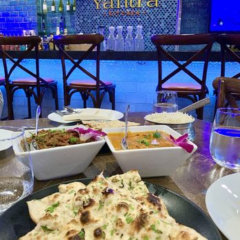 Yantra Kitchen - Butter Paneer Masala (right) and Baingan Bhartha (left) with Garlic Naan bread. - Indian Near Me - Artesia, California