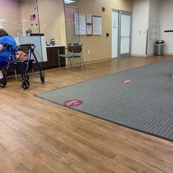Jacqueline McGowan, MD, CAQSM - Receptionist area. Temperature check, masks, and distancing in practice.