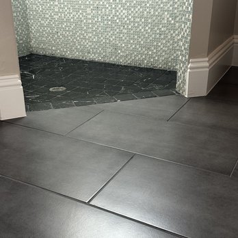 Grout Like New - a bathroom with a tiled floor - Flooring Near Me - Fort Myers, Florida