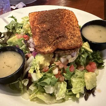 Ford's Garage Sanford - Blackened Salmon Salad - 8oz Blackened Norwegian Atlantic Salmon, Mixed Greens, Cherry Tomatoes, Red Onions, Cucumbers, and Avocado - Burgers Near Me - Sanford, Florida Ford's Garage Sanford - Blackened Salmon Salad - 8oz Blackened Norwegian Atlantic Salmon, Mixed Greens, Cherry Tomatoes, Red Onions, Cucumbers, and Avocado - Burgers Near Me - Sanford, Florida