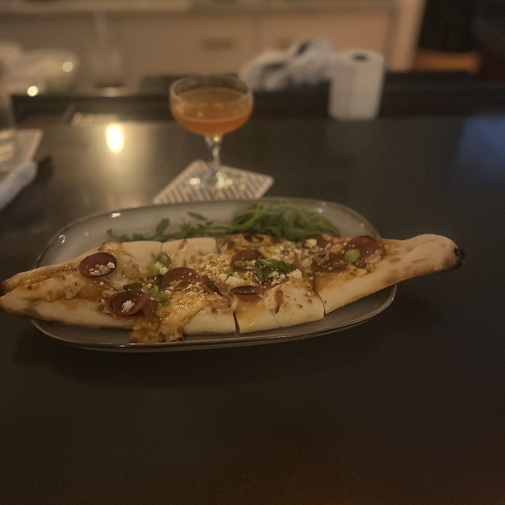 Colleagues & Lovers - a plate of pizza and a glass of wine - Cocktail Bars Near Me - Savannah, Georgia Colleagues & Lovers - a plate of pizza and a glass of wine - Cocktail Bars Near Me - Savannah, Georgia
