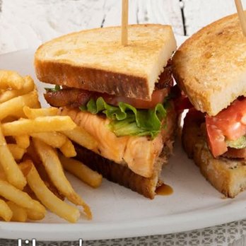 Houlihan's - Salmon BLT this is a stock photo due to issues but it looks exactly the same except for a little souffle of ketchup - Bars Near Me - Overland Park, Kansas Houlihan's - Salmon BLT this is a stock photo due to issues but it looks exactly the same except for a little souffle of ketchup - Bars Near Me - Overland Park, Kansas