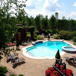 Seasonal Landscaping & Nursery - Paver patio surrounding pool