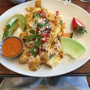 Grace's Table - Chilaquiles Scrambled Eggs with Tortillas, Tasso Ham Cheddar, Pico de Gallo and Lime Crème Frâiche. Sauce on side - New American Near Me - Napa, California Grace's Table - Chilaquiles Scrambled Eggs with Tortillas, Tasso Ham Cheddar, Pico de Gallo and Lime Crème Frâiche. Sauce on side - New American Near Me - Napa, California