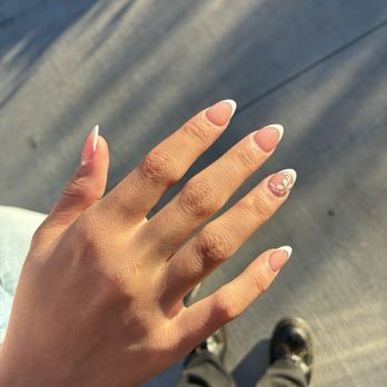 LV Nails - My sisters nails! almond french tip with a flower design - Nail Salons Near Me - Anaheim, California