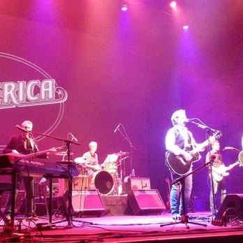 America in Concert - a band playing on stage - Music Venues Near Me - Honolulu, Hawaii America in Concert - a band playing on stage - Music Venues Near Me - Honolulu, Hawaii