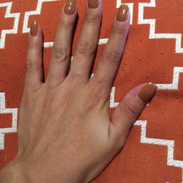 SNS NAILS. No UV light, lasts at least 2 weeks, no chipping.  Colors are endless & helps make your natural nails stronger!