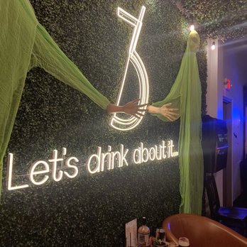 Three Bridges Distillery And Taproom - Logo wall in seating area - Distilleries Near Me - Midland, Michigan