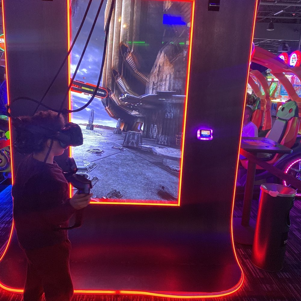 Dave & Buster's - a young boy playing a video game - American Near Me - Brooklyn, New York Dave & Buster's - a young boy playing a video game - American Near Me - Brooklyn, New York