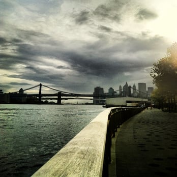 East River Greenway - East River Esplanade. Manhattan & Brooklyn Bridges in the distance - Parks Near Me - New York, New York East River Greenway - East River Esplanade. Manhattan & Brooklyn Bridges in the distance - Parks Near Me - New York, New York
