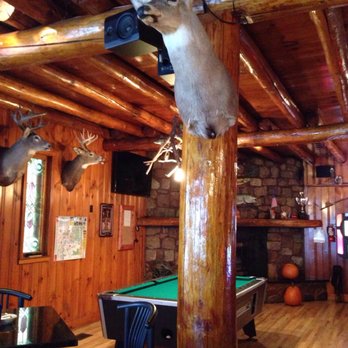 Bierstube Lounge - a deer head mounted on a pole - American Near Me - Cable, Wisconsin