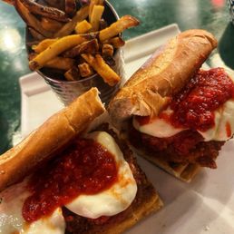 Chicken Parmesan sandwich with fries Chicken Parmesan sandwich with fries