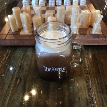 The Brew Cafe - 12oz Nitro and chess board - Coffee & Tea Near Me - Lansing, Michigan