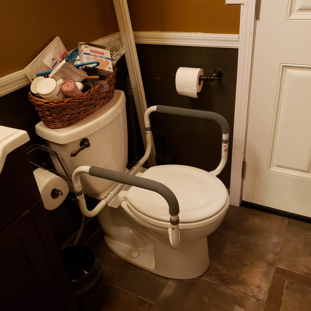 Slip Busters - a toilet and sink in a bathroom - General Contractors Near Me Slip Busters - a toilet and sink in a bathroom - General Contractors Near Me