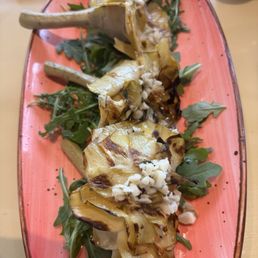 Artichoke appetizer. Tasty white wine and garlic sauce but a bit firm. Artichoke appetizer. Tasty white wine and garlic sauce but a bit firm.