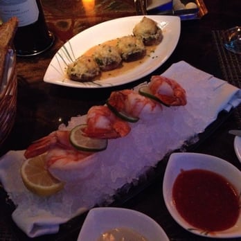 Bimini Steakhouse - Our appetizer with stuffed mushrooms with crab and jumbo shrimp. Wonderful with the side sauces. - Steakhouses Near Me - Reno, Nevada