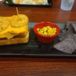 The Colony Gallipolis - Bbq sandwich on texas toast with  cheese on top and hashbrown rings.
