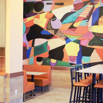 Quik Chik - a colorful mural on the wall of a restaurant - Fast Food Near Me - Mississauga, Ontario