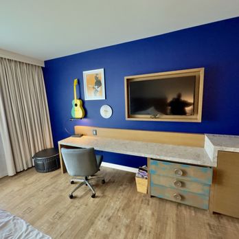 Hotel Indigo Gainesville-Celebration Pointe - Desk with USBs hidden fridge - Hotels Near Me - Gainesville, Florida Hotel Indigo Gainesville-Celebration Pointe - Desk with USBs hidden fridge - Hotels Near Me - Gainesville, Florida