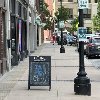 The Blue Feather - street side a frame sign - Bars Near Me - Lewiston, Maine